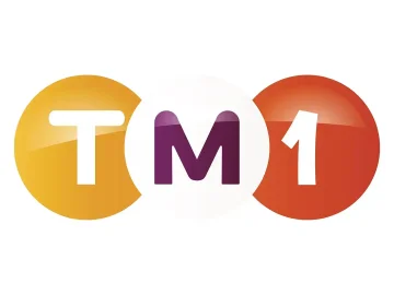 The logo of TM1 TV